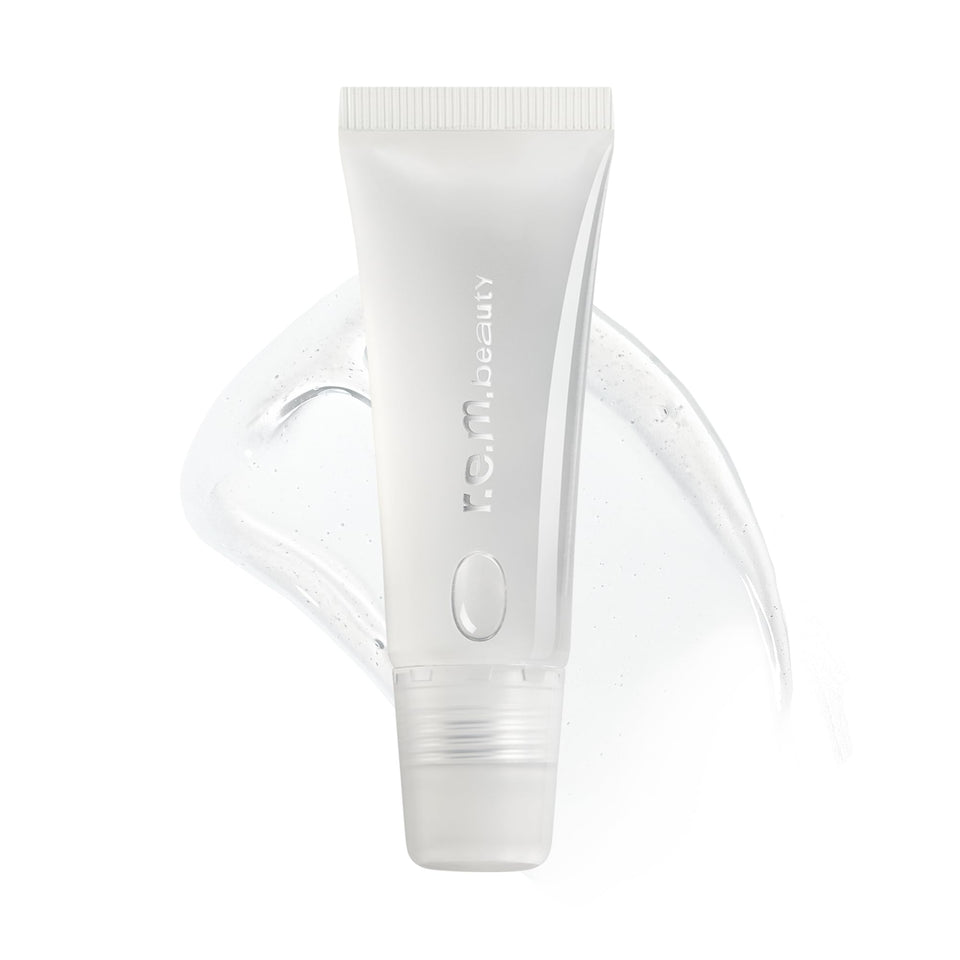 r.e.m. beauty clear gloss tube front view showing glossy packaging and brand