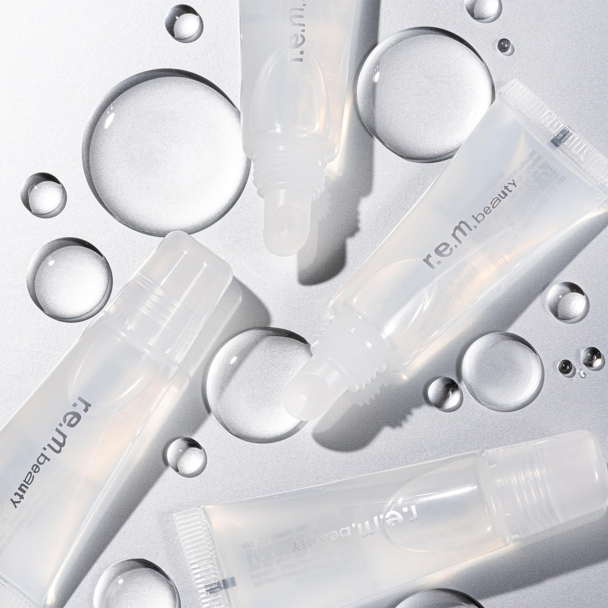 r.e.m. beauty gloss applied on lips in lifestyle scene showing high shine benefit