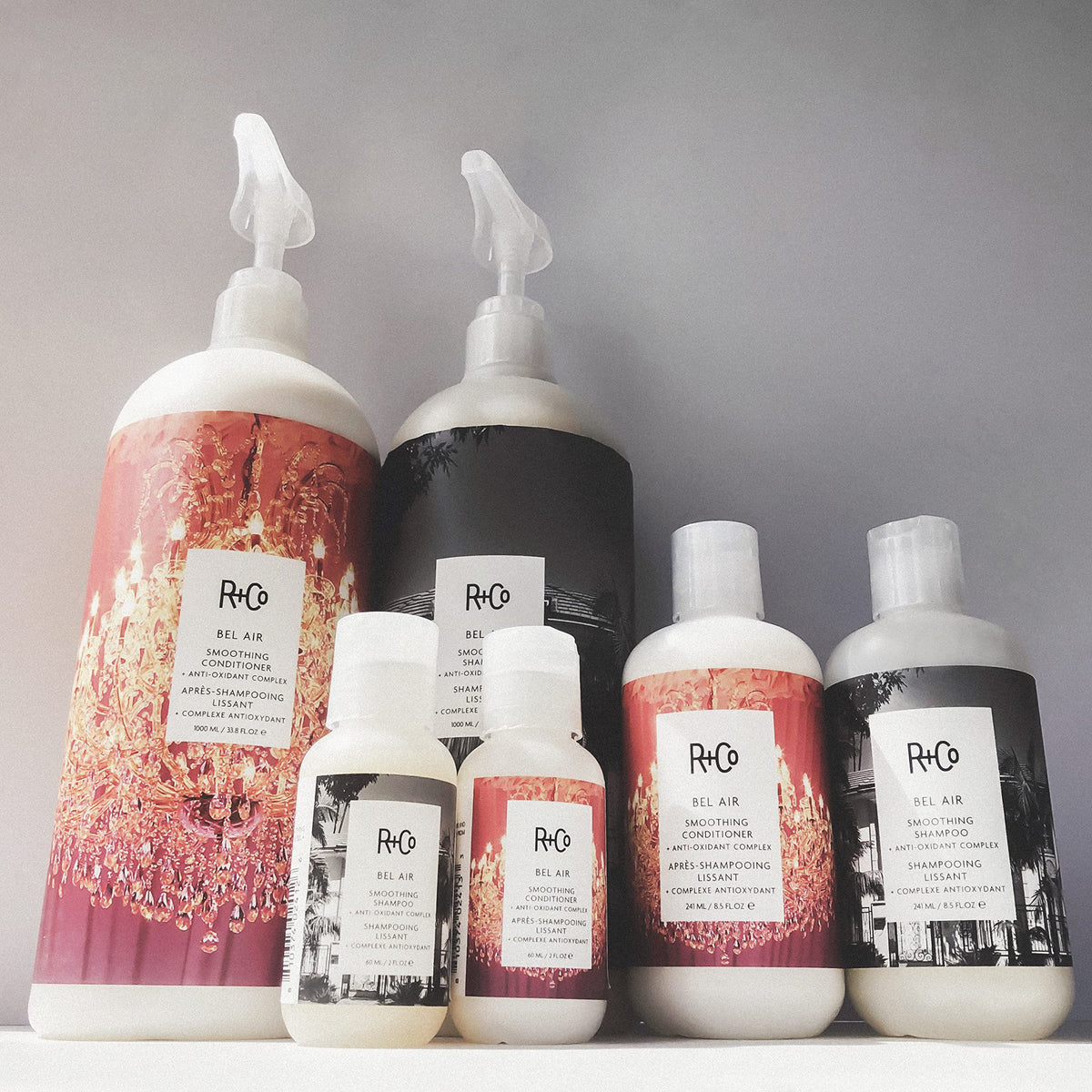 R+Co Bel Air applied to wet hair in shower, shows smooth detangling benefit