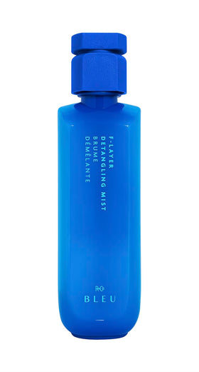 R+Co BLEU F-Layer front packaging showing label and bottle — clear product identity and lightweight benefits