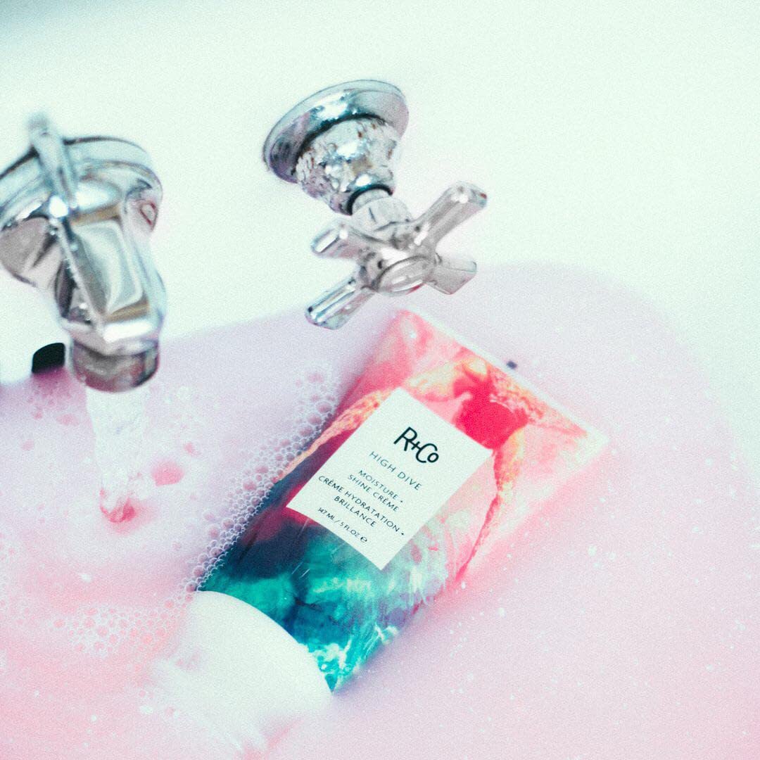 R+Co HIGH DIVE open jar revealing product inside and user-friendly cream for softening