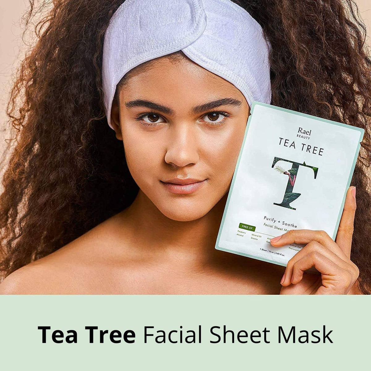 Rael hand holding mask to show size and face coverage for fit