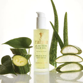 Rahua bottle next to hand showing 6 fl oz size for scale and portability