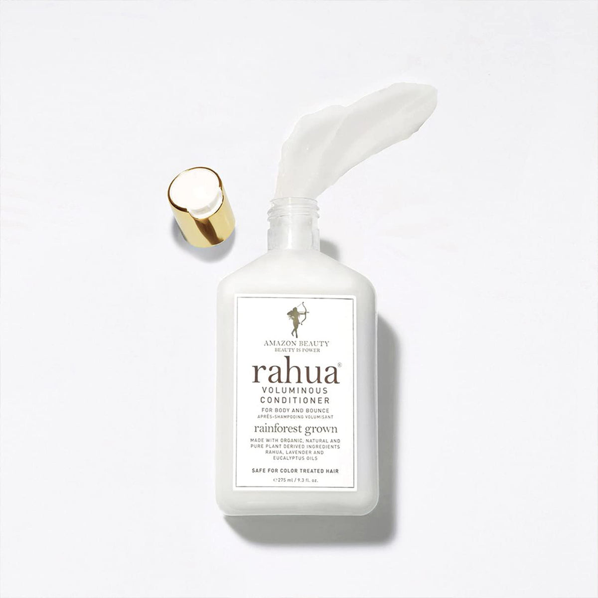 Rahua conditioner bottle in hand showing 9.3 fl oz scale