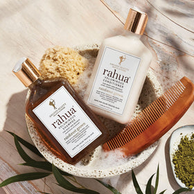 Rahua bottle with rainforest image emphasizing sustainable sourcing