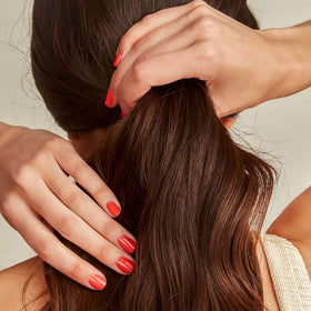 Rahua conditioner being applied in shower showing detangling and manageability benefits