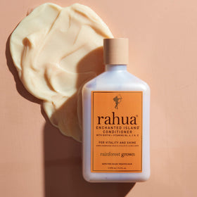 Rahua bottle in hand for size comparison and travel-friendly 9.3 fl oz perspective