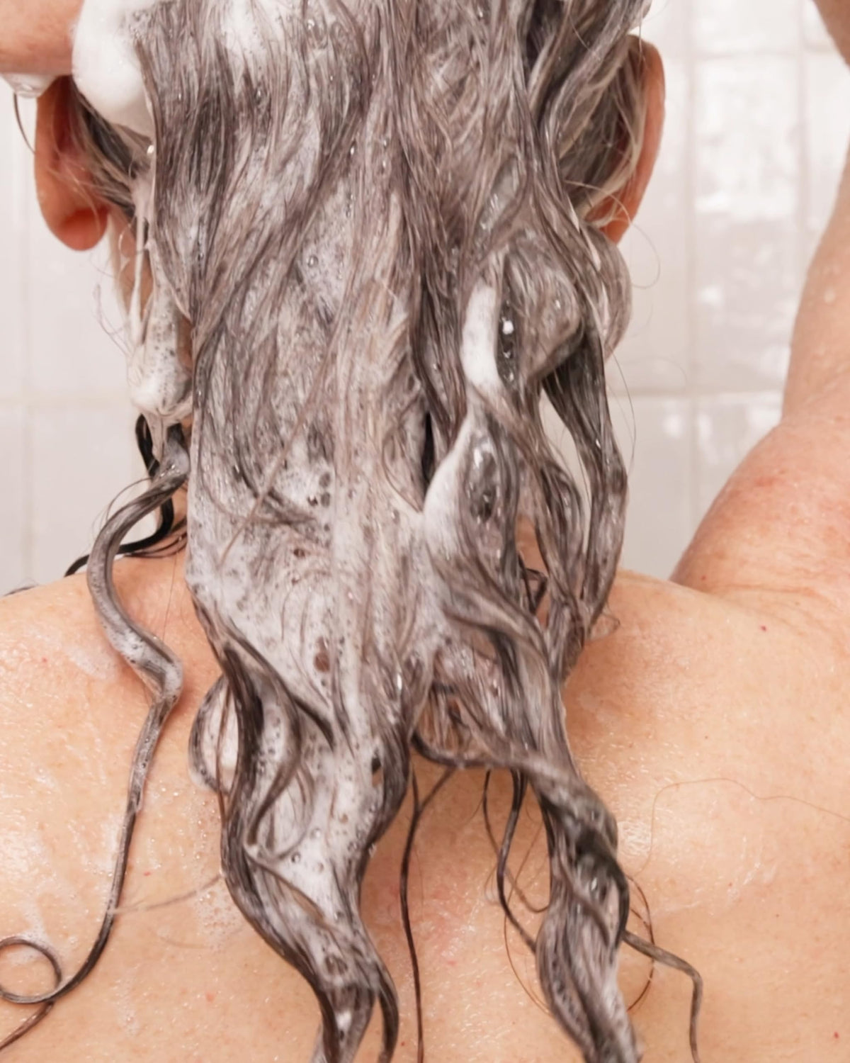 Rahua shampoo creamy lather closeup demonstrating rich moisture and slip