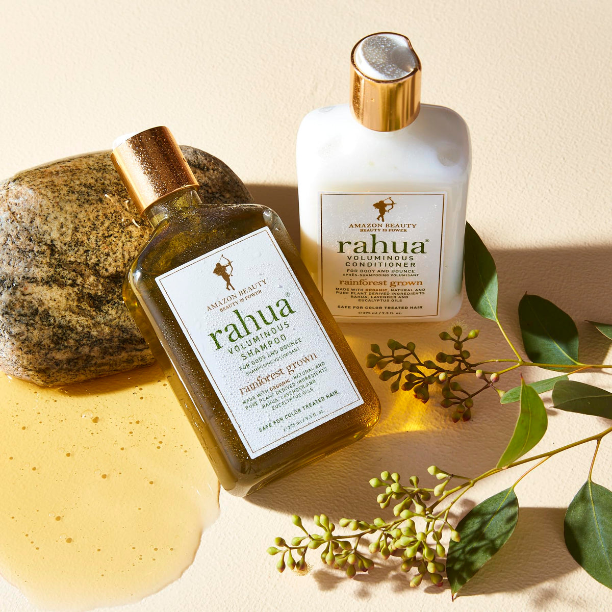 Rahua 9.3 oz bottle in hand demonstrating travel-friendly size
