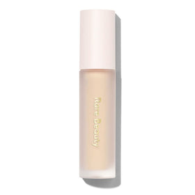 Rare Beauty Always An Optimist front packaging showing tube and label, brightens shadow payoff