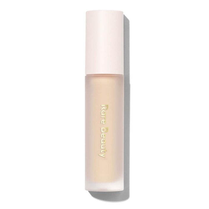 Rare Beauty Always An Optimist front packaging showing tube and label, brightens shadow payoff