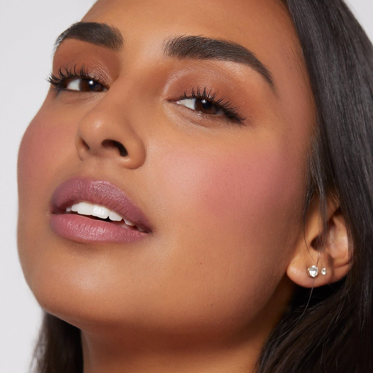 Rare Beauty cheek before and after comparison illustrating subtle color boost and lift