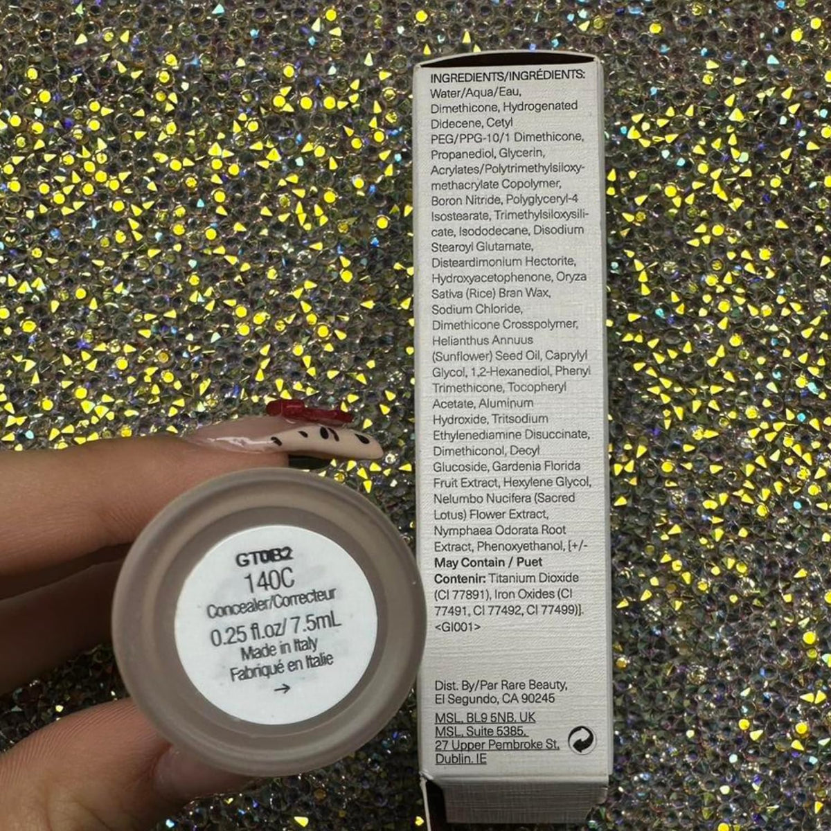 Rare Beauty swatch of 140C on arm illustrating cool neutral tone