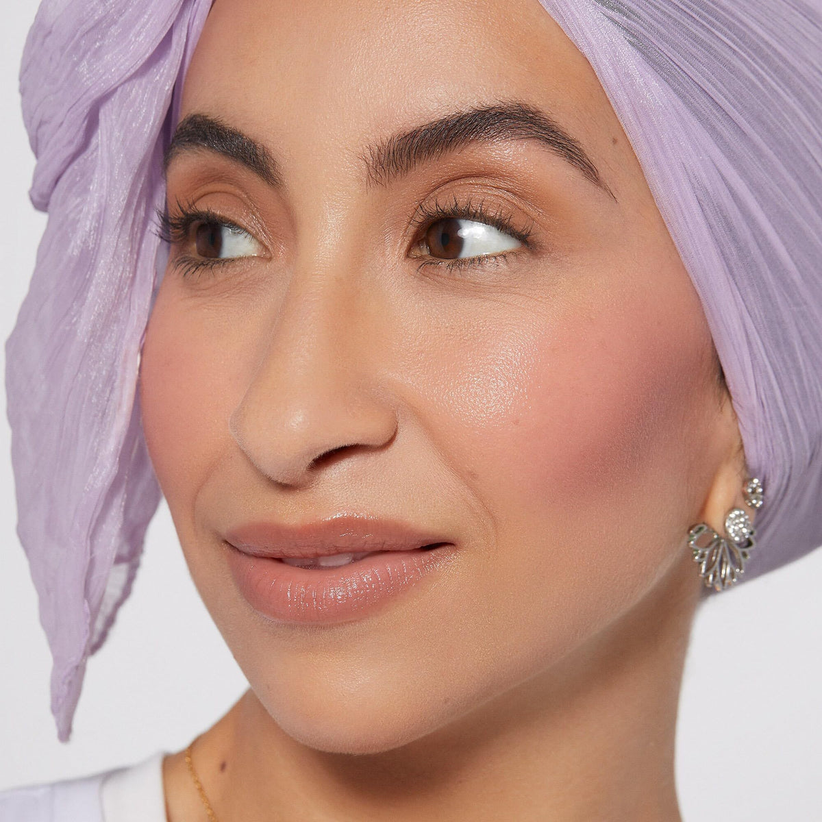 Rare Beauty liquid blush texture on dropper highlighting smooth, blendable formula benefits