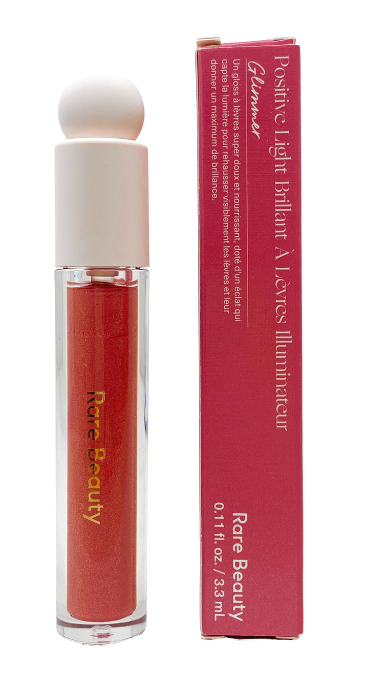 Rare Beauty Glimmer front packaging showing tube and applicator with glossy shine