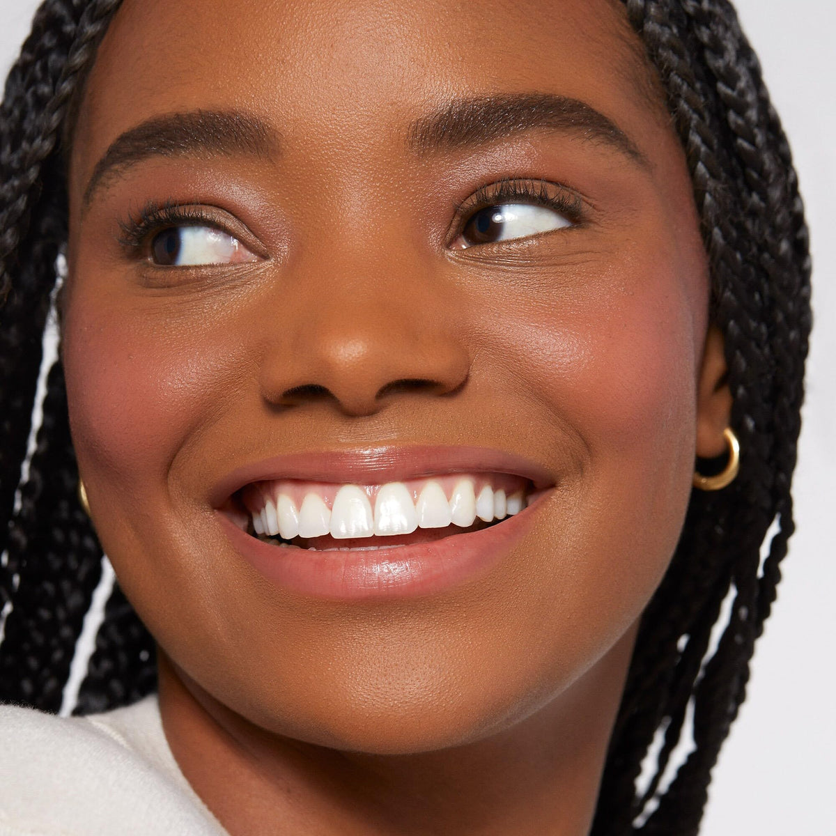 Rare Beauty application with fingertip demonstrating easy blending and natural finish advantages