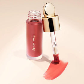 Rare Beauty product staged in a makeup bag conveying portability and everyday convenience