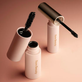 Rare Beauty lifestyle image of model wearing the mascara and brow gel for polished eyes