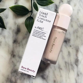 Rare Beauty applicator wand with creamy product showing easy application