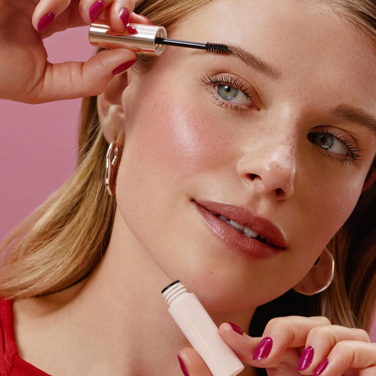 Rare Beauty mascara wand close-up demonstrating precise application and volumizing effect
