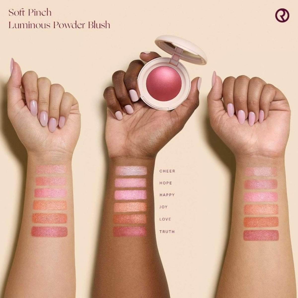 Rare Beauty arm swatch showing Love Terracotta payoff and warm glow