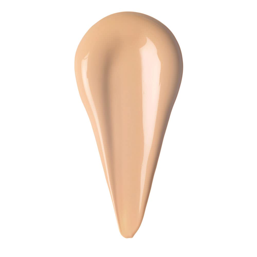 Rare Beauty close-up of doe-foot applicator delivering peach-tinted primer for smooth lids