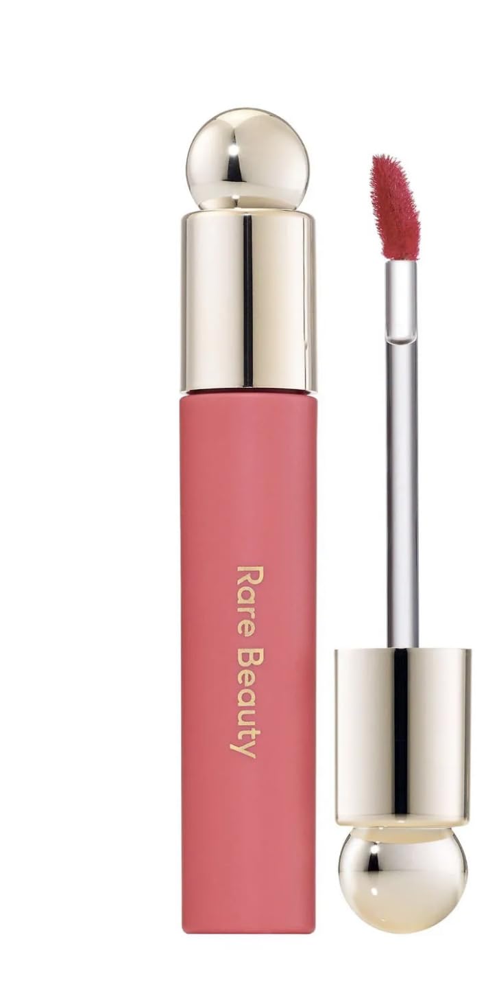 Rare Beauty lip oil front packaging showing Happy shade and glossy applicator benefit