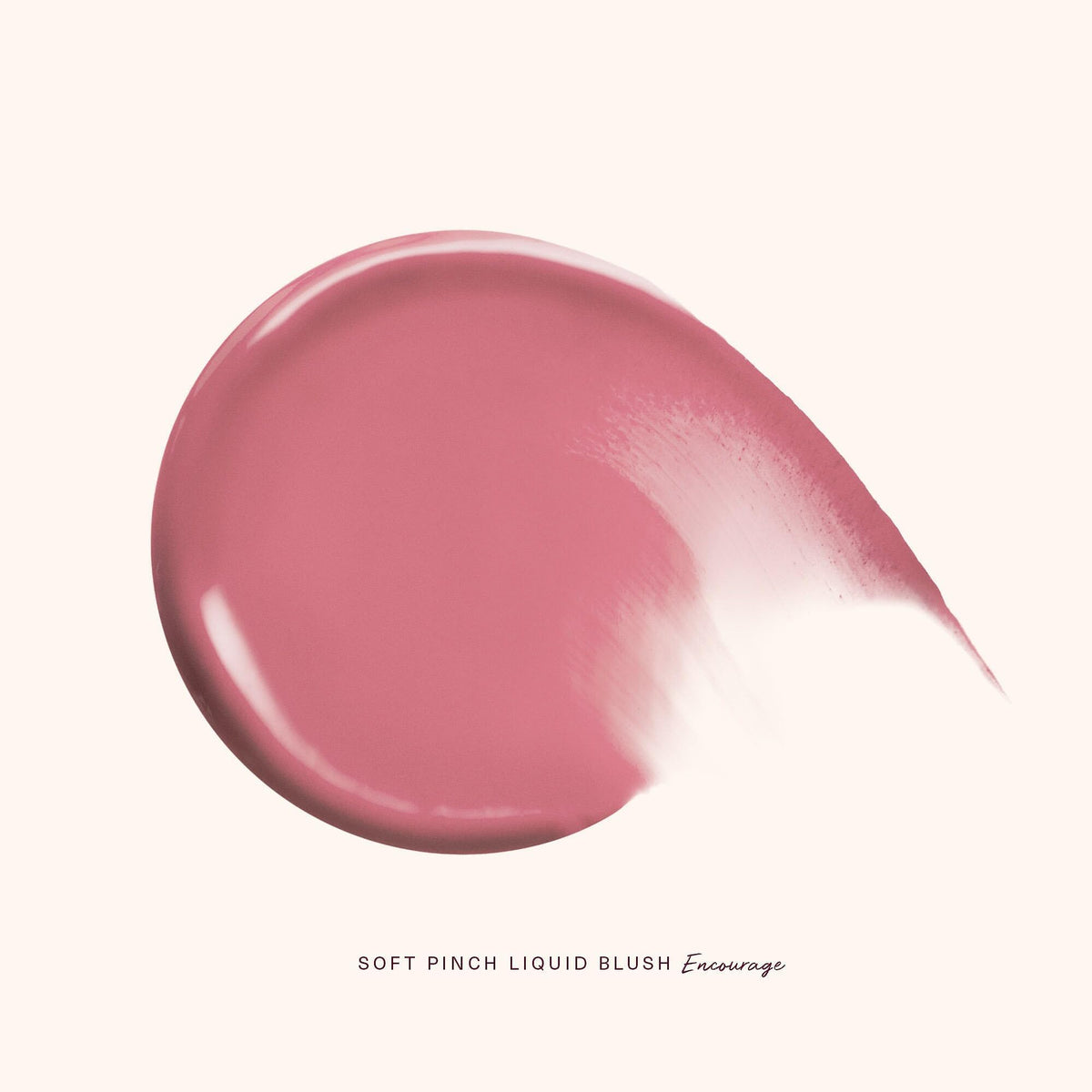 Rare Beauty swatch of Encourage on arm showing buildable, natural-pink payoff for reference