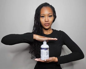 Rasttafari Hair Care shampoo placed on a bathroom shelf conveying everyday routine