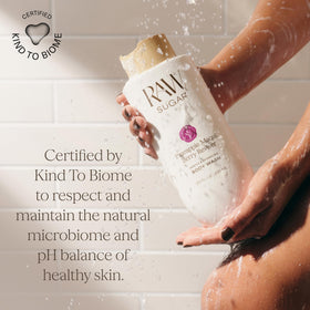 RAW SUGAR 20oz bottle in hand to show true size and value