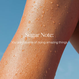 RAW SUGAR bottle placed on shower shelf in lifestyle setting to inspire daily routine