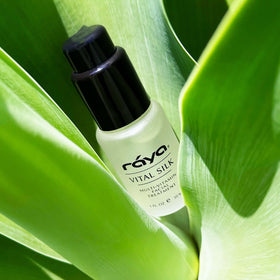 Raya Vital Silk Serum on vanity with skincare for a refreshed routine