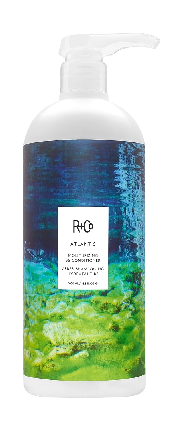 R+Co Atlantis front bottle showing large 33.8 oz size and label benefit