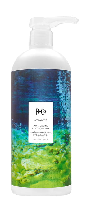 R+Co Atlantis front bottle showing large 33.8 oz size and label benefit