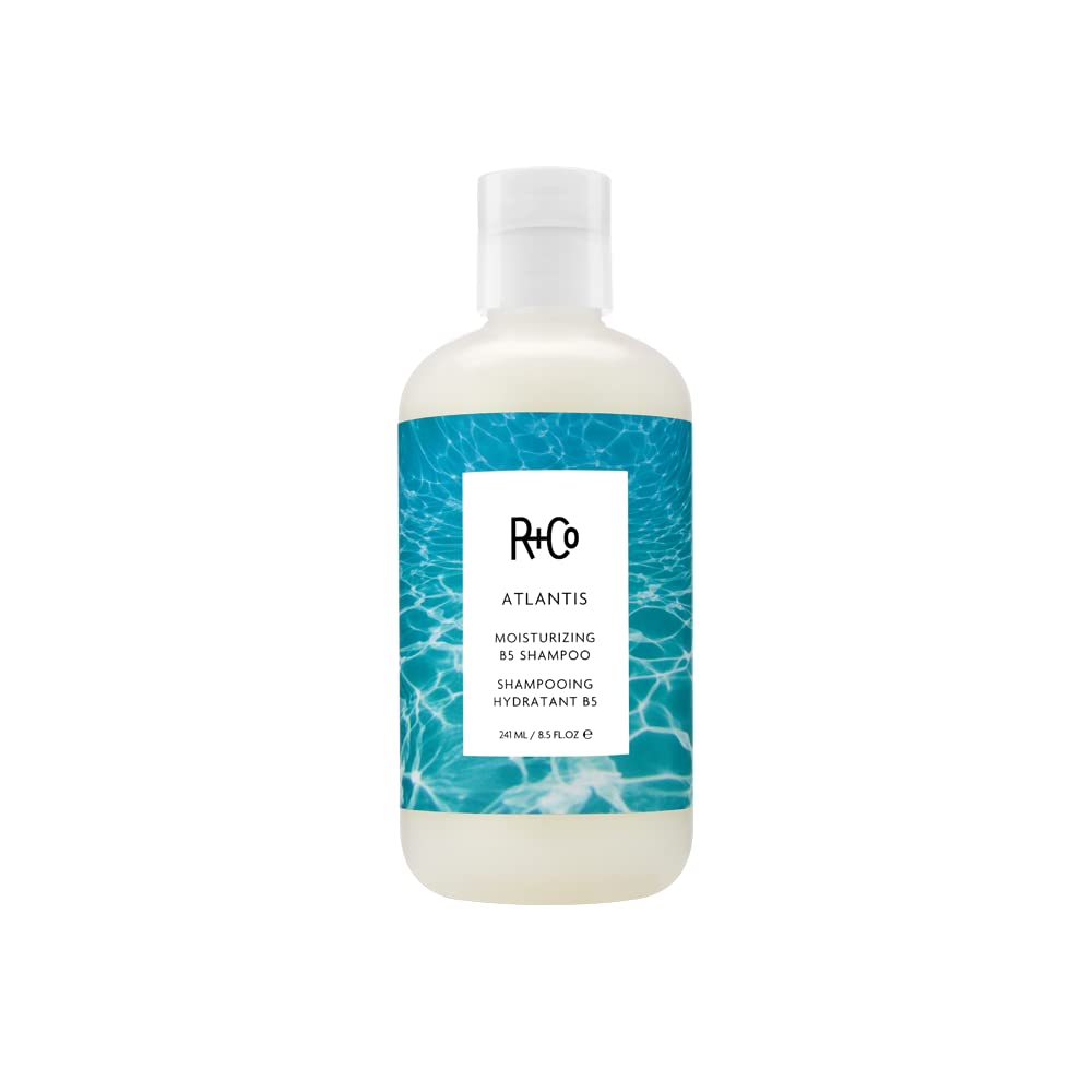 R+Co Atlantis front pump bottle showing label and hydrating shampoo benefits