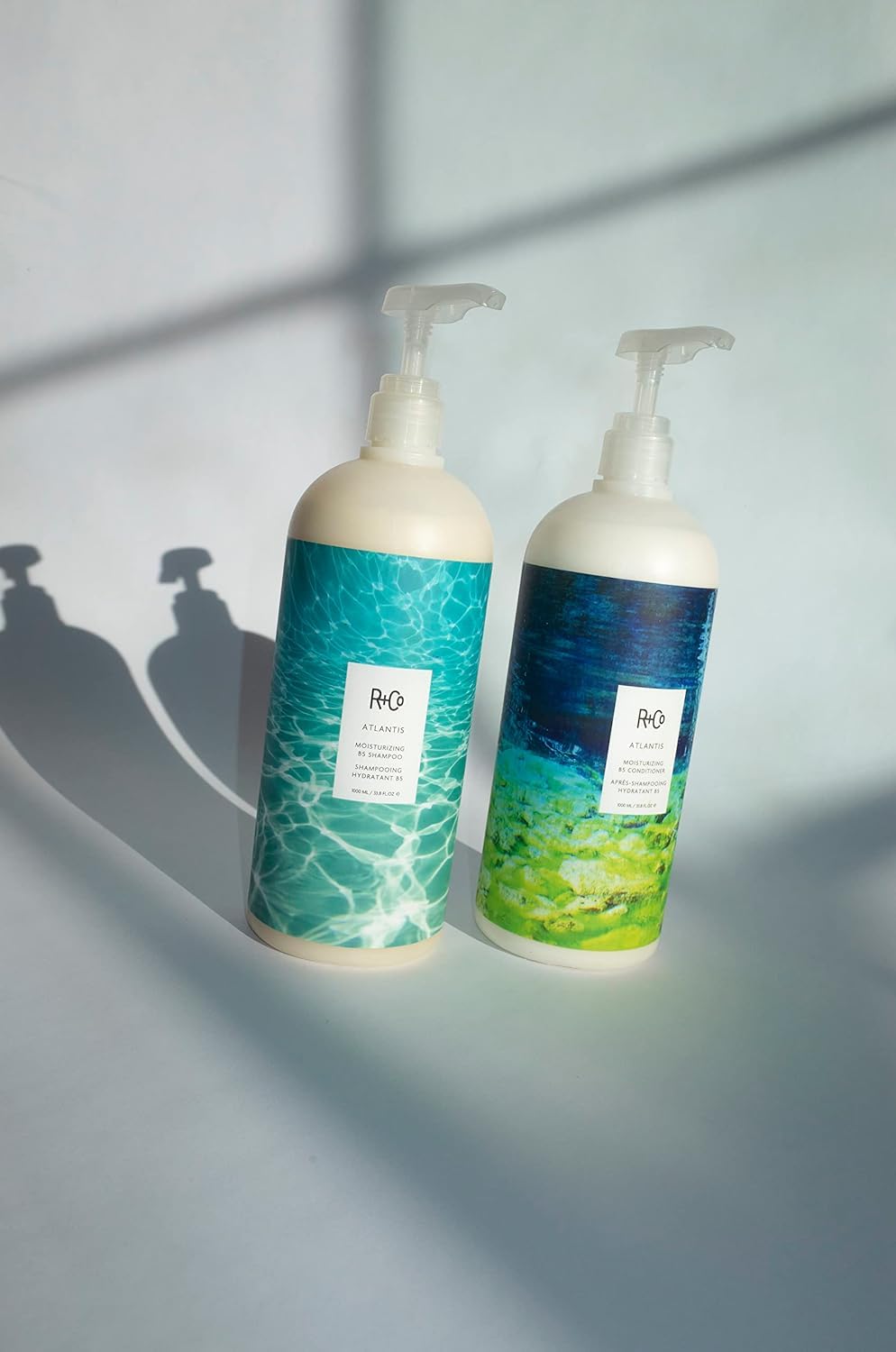 R+Co Atlantis being applied to wet hair mid-lengths to ends for hydration