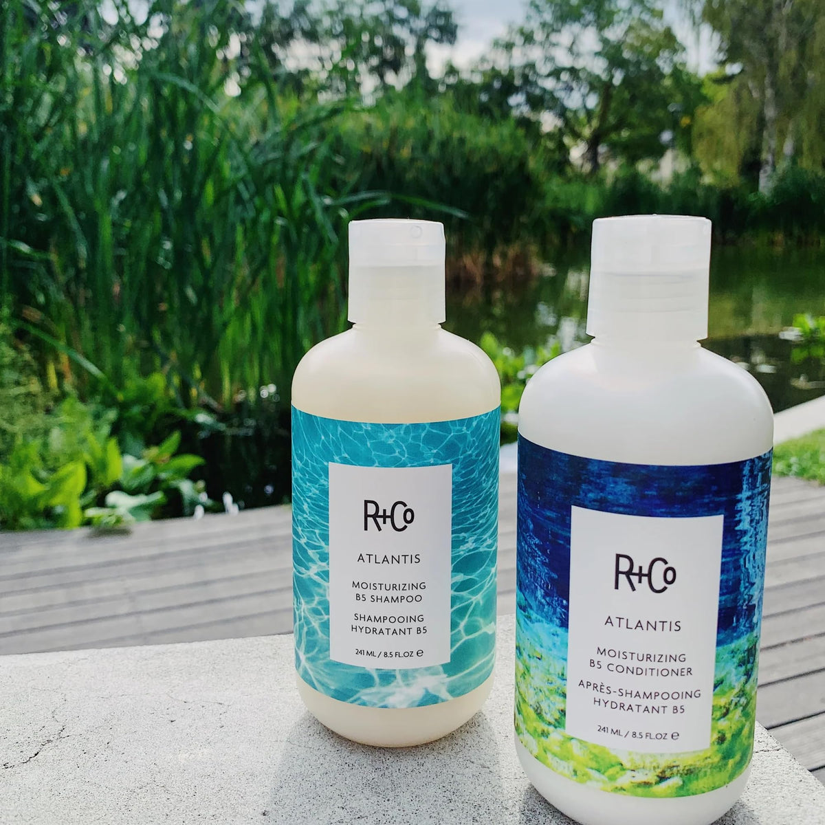R+Co Atlantis in use shampooing hair showing improved manageability and slip