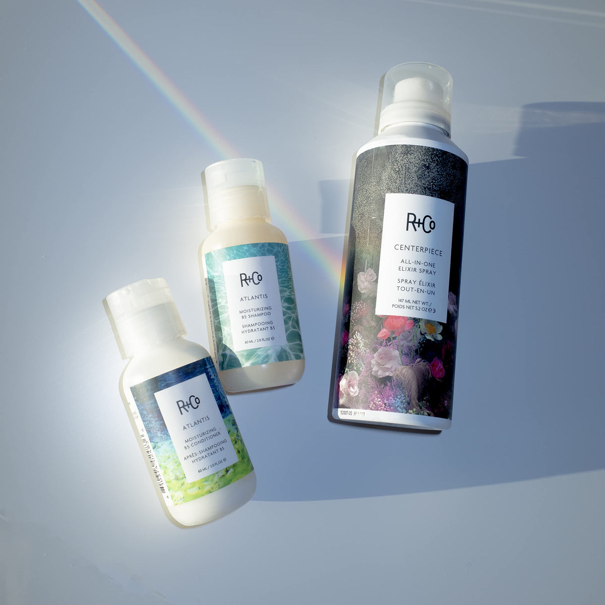 R+Co Atlantis shampoo in shower use showing improved manageability benefit