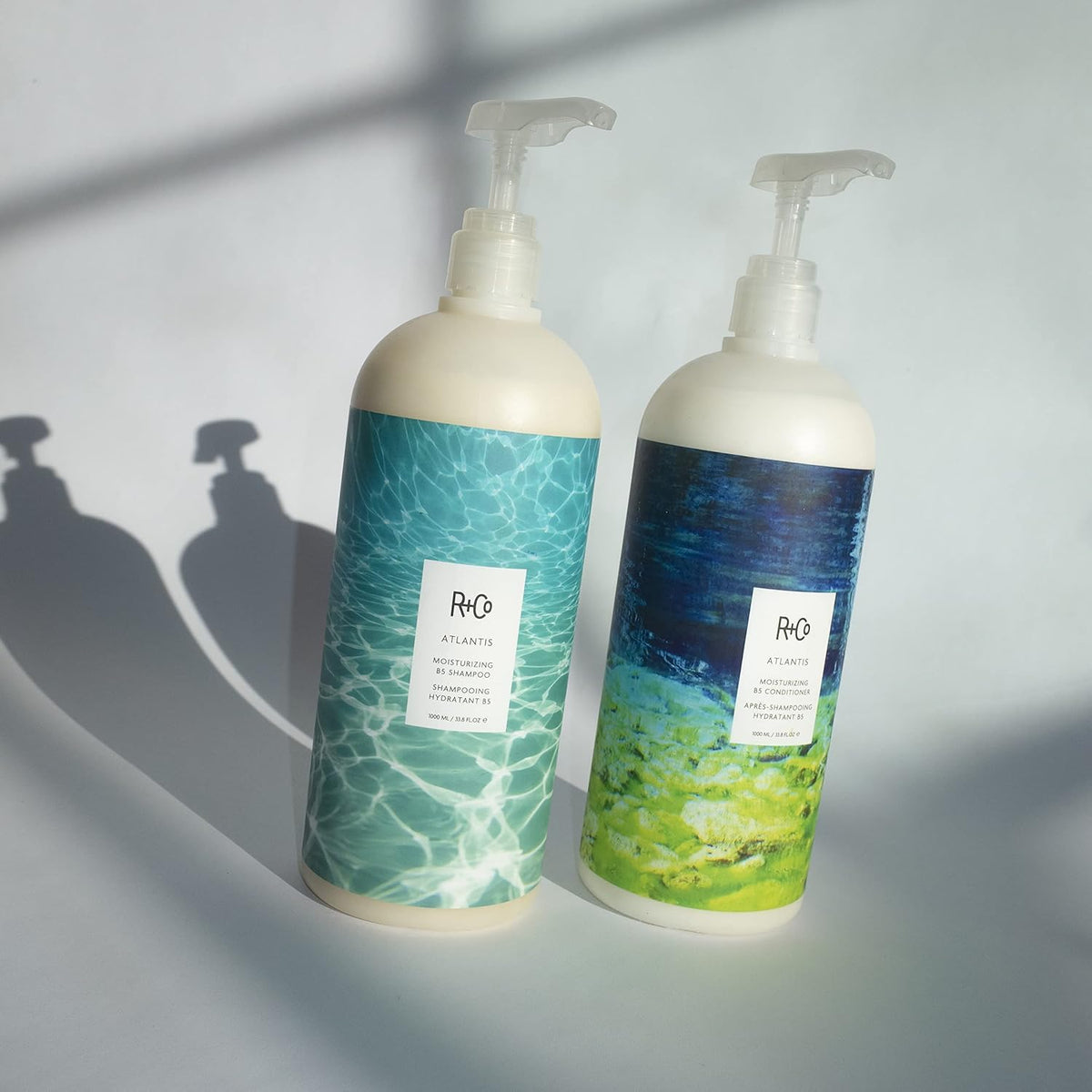 R+Co Atlantis ingredient blend bottle highlighting vitamins and natural derivatives