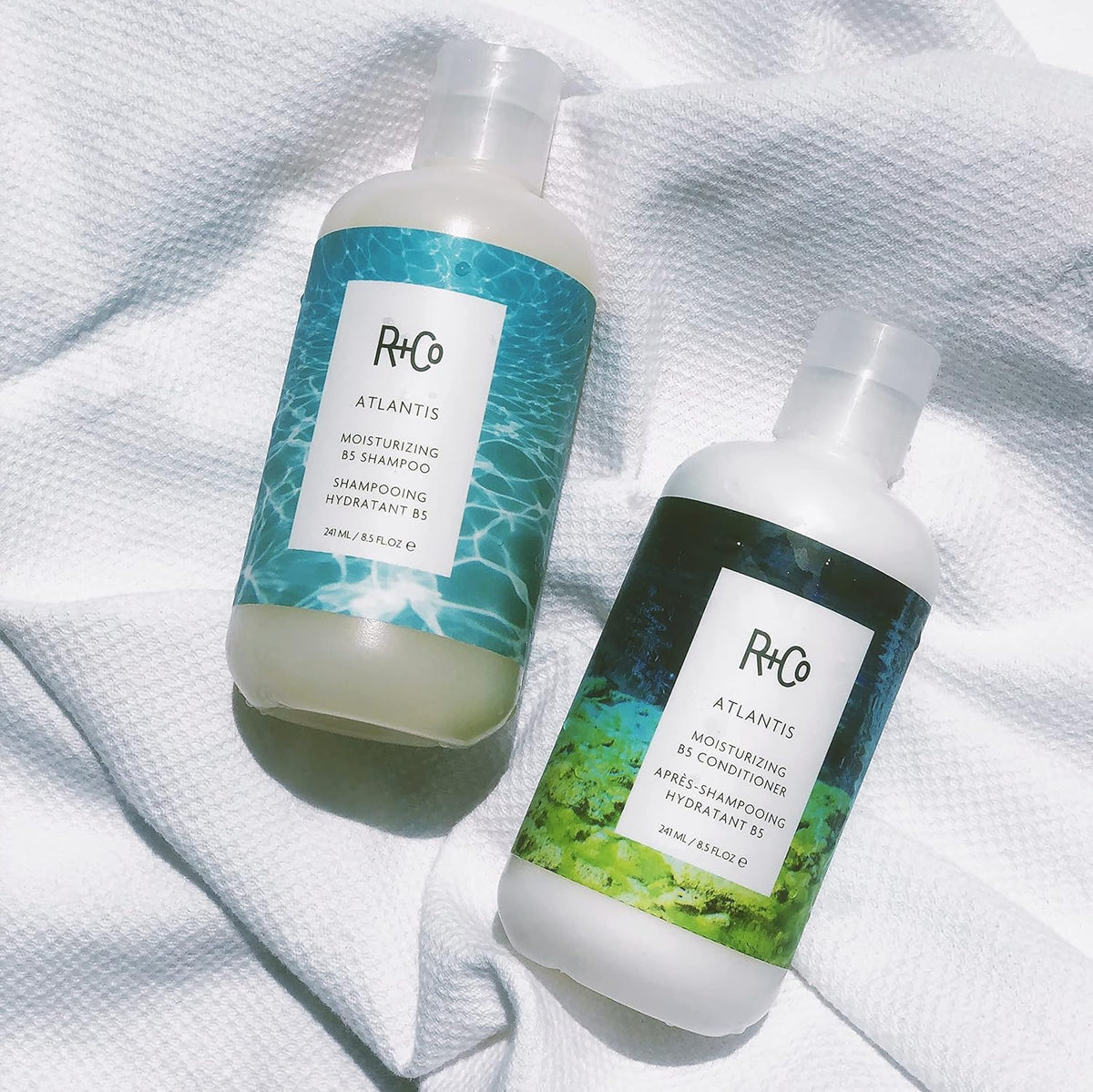 R+Co Atlantis natural ingredient display with rice bran and acai oils