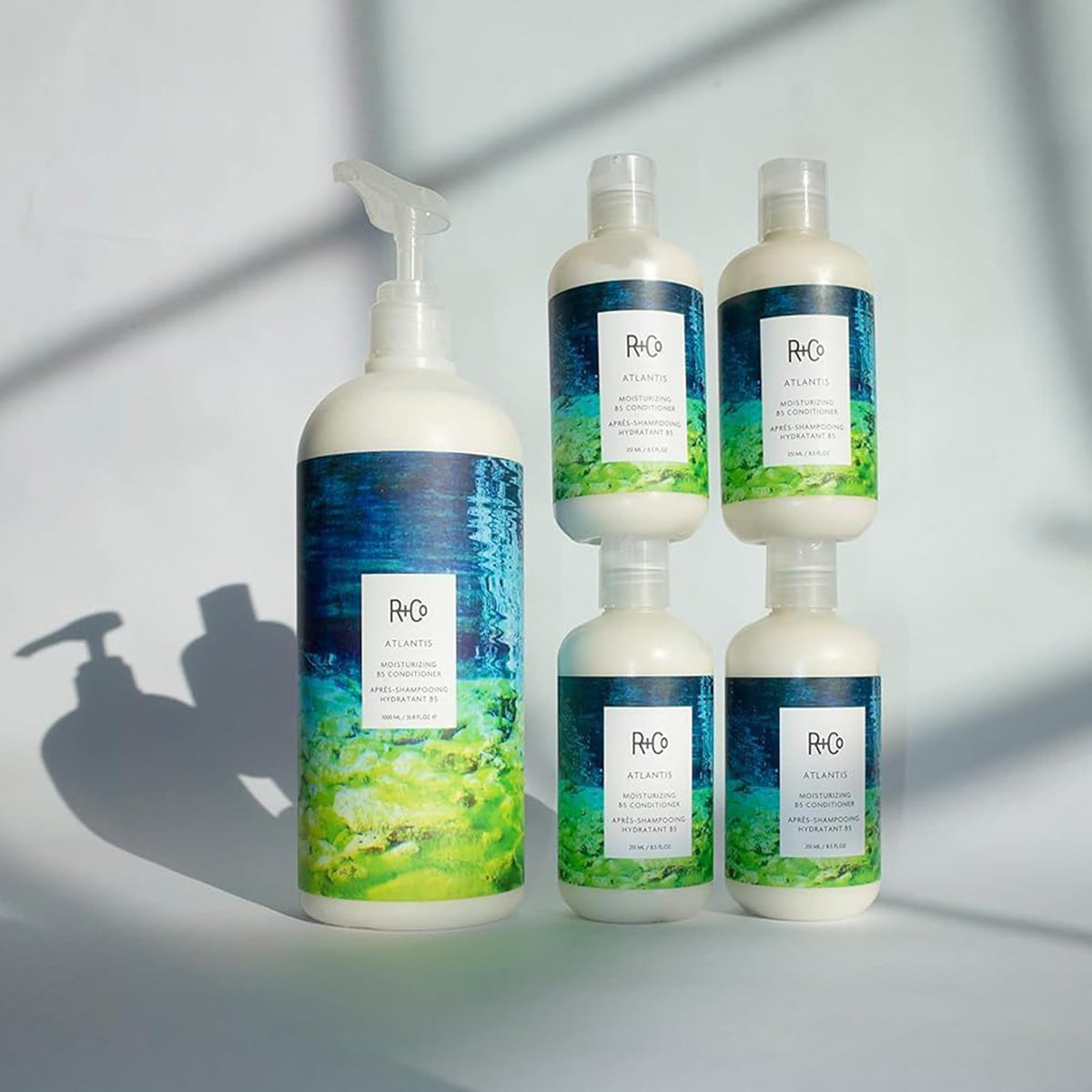 R+Co ATLANTIS on bathroom shelf in lifestyle scene showing routine convenience benefit