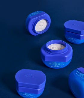 R+Co BLEU jar beside a ruler for scale showing compact 1.7 oz size convenience
