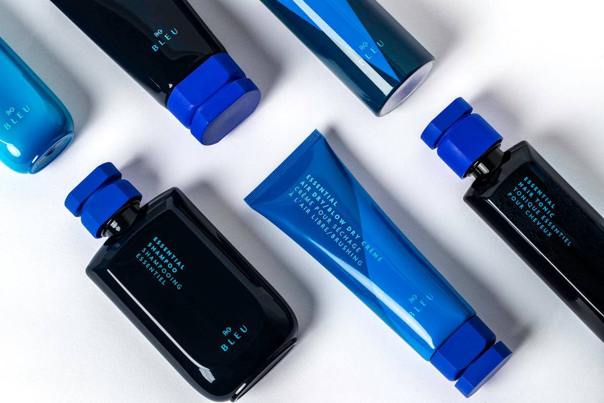 R+Co BLEU 4.2 oz bottle next to a ruler to show compact, travel-friendly size