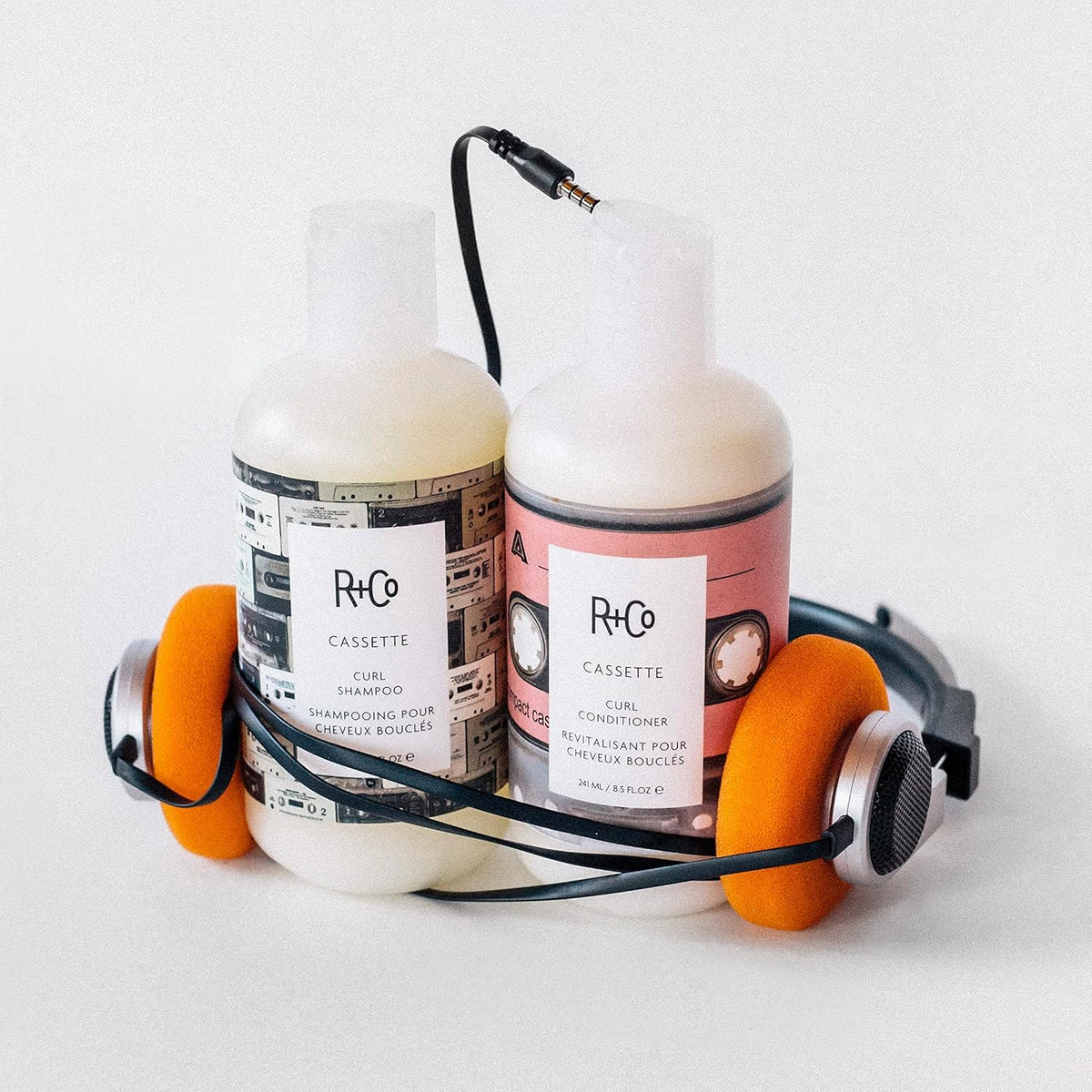R+Co Cassette in-shower use on curly hair, demonstrating detangling and definition