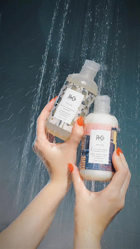 R+Co Dallas on vanity with other grooming items showing salon-quality styling