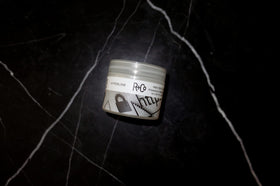 R+Co Hyperlink jar in hand to show true 2 oz scale and portability