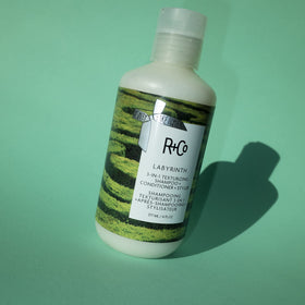 R+Co Labyrinth in-hand under shower showing application and time-saving routine