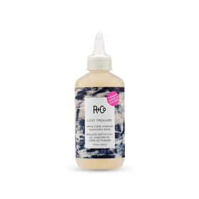 R+Co bottle front view showing product and clean packaging benefit