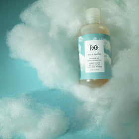 R+Co product label closeup highlighting repairing ingredients and benefits