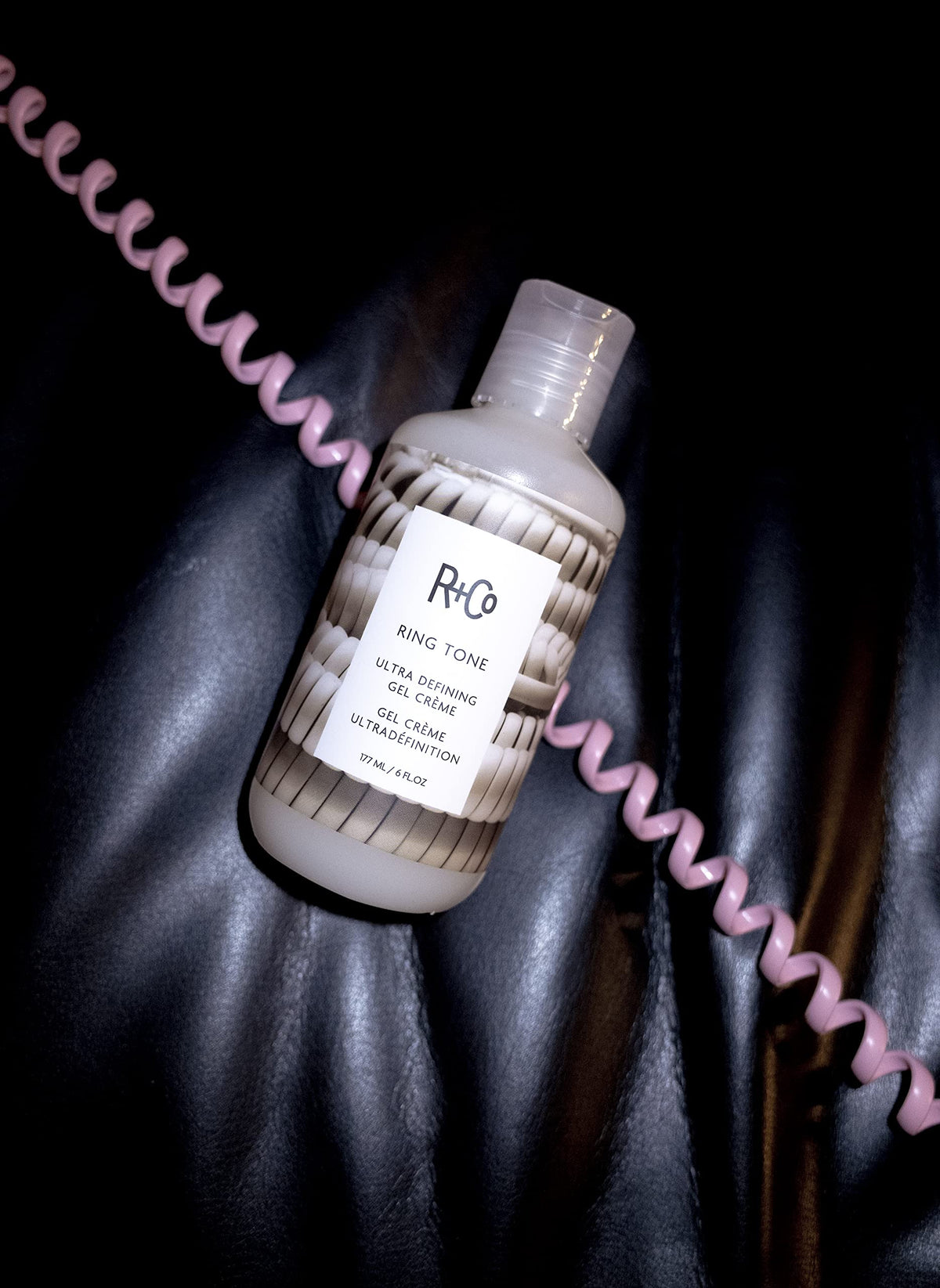 R+Co Ring Tone next to a ruler and hand for scale, illustrating the 177 ml size